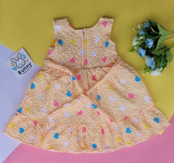 yellow cotton back knot frock for baby